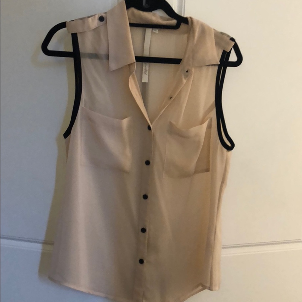 Sheer nude sleeveless blouse with black piping